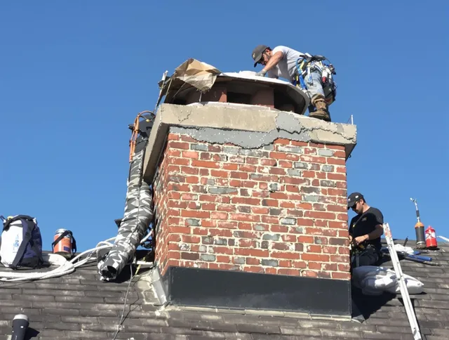 Willimantic Chimney Sweep installing a custom chimney crown in Willimantic, CT