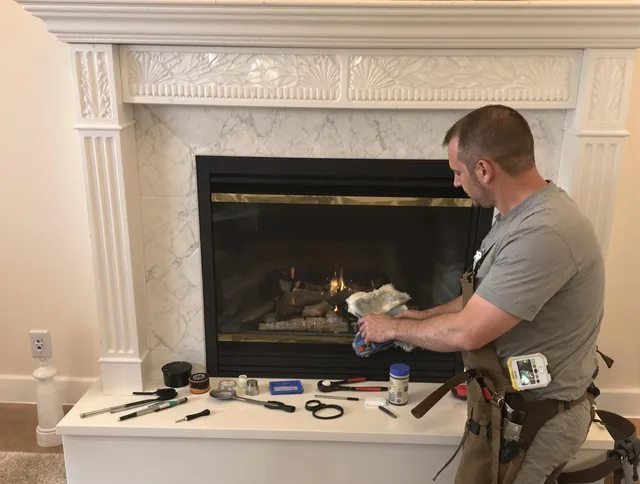 Willimantic Chimney Sweep performing fireplace maintenance in Willimantic, CT